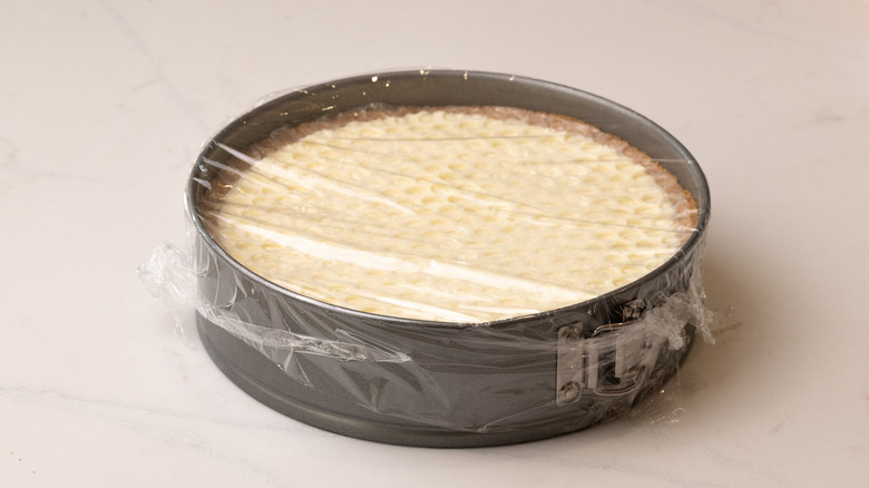 honeycomb pie in cake pan wrapped with food wrap