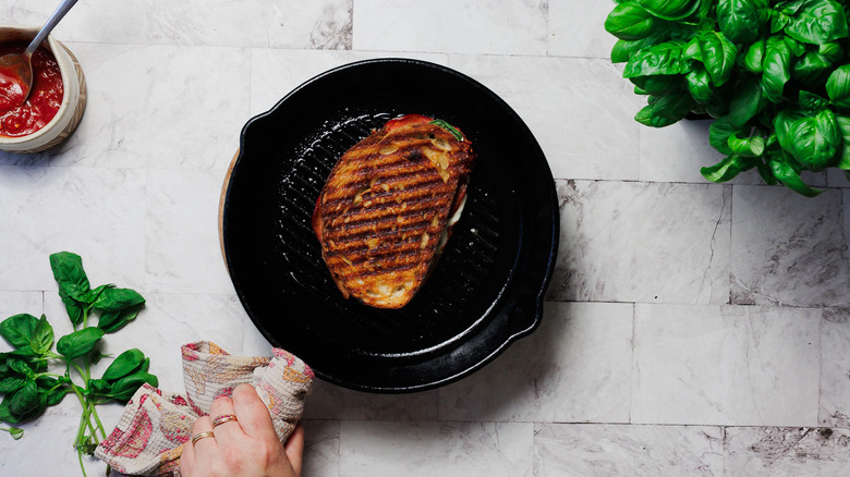 Pizza grilled cheese in cast iron pan