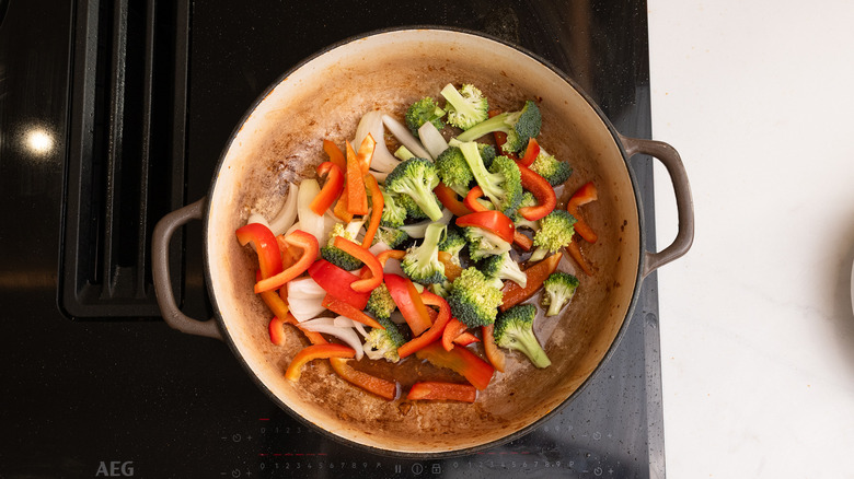 vegetables sautéing in a pan