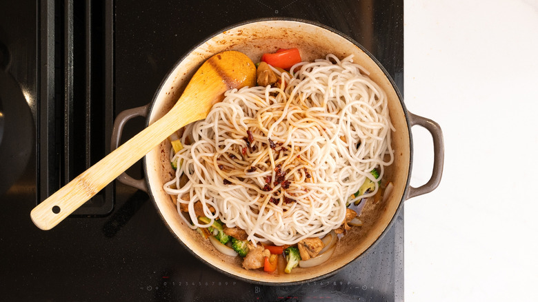 noodle dish in pan with sauce