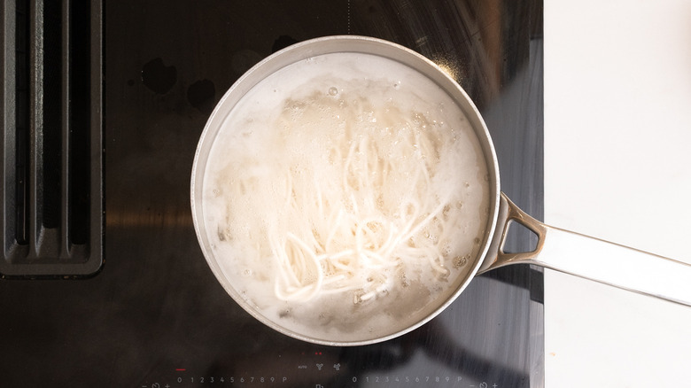 noodles cooking in a pan