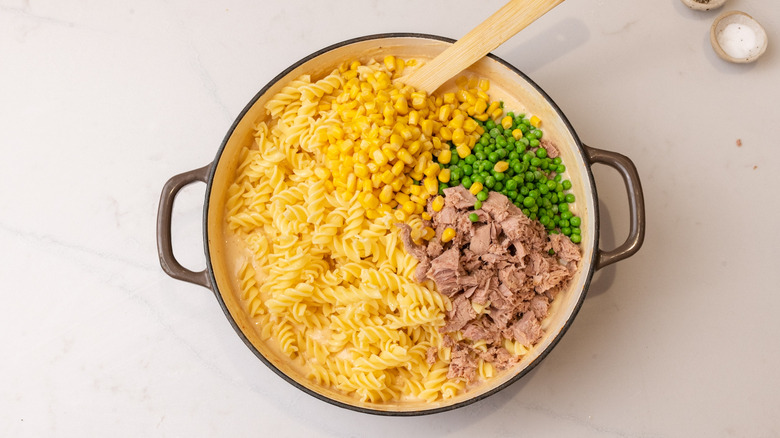 assembling tuna casserole in pan