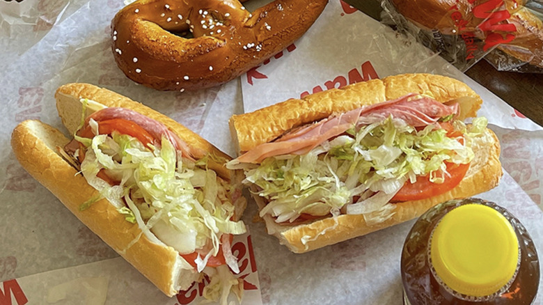 selection of wawa subs with pretzels on paper