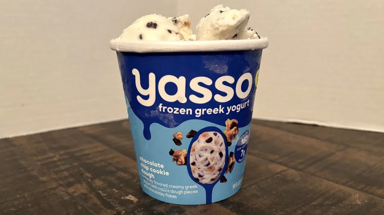 Pint of frozen Greek yogurt on table