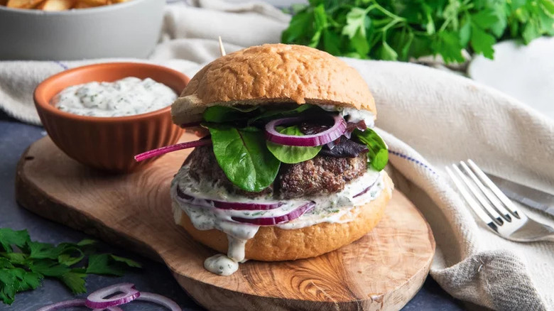 Lamb burger on a wooden platform