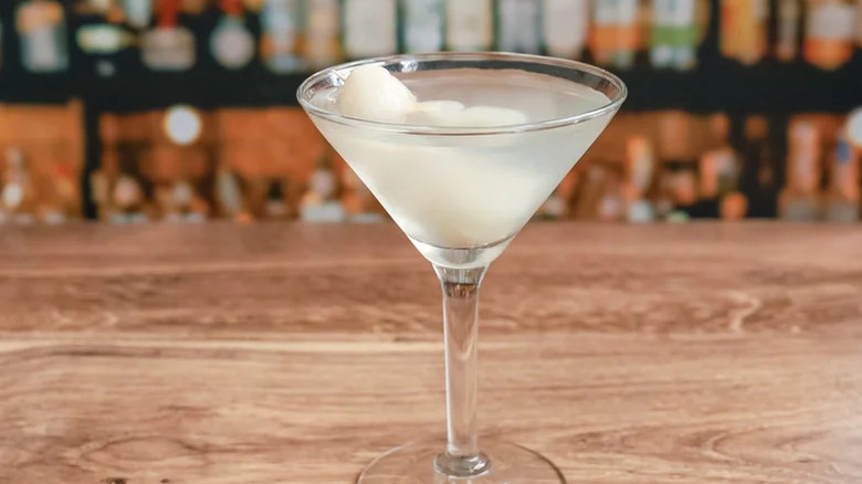 Lychee martini on a wooden counter