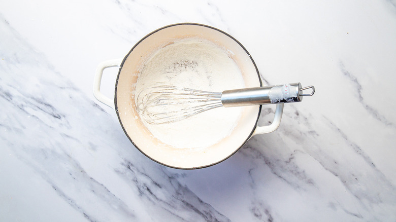 Whisk and cornstarch in pot