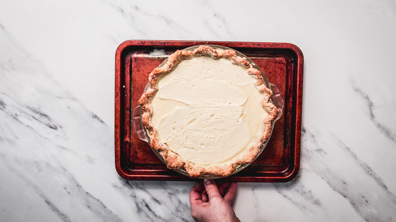 Chilled pie on baking sheet