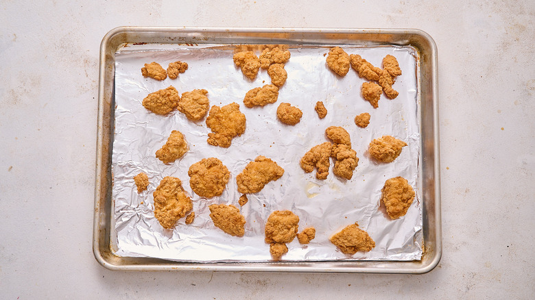 baked chicken bites on a sheet tray