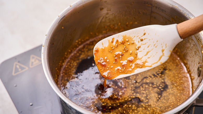 spatula coated with orange chicken sauce