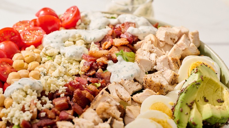 Close up of Cobb salad with ranch dressing