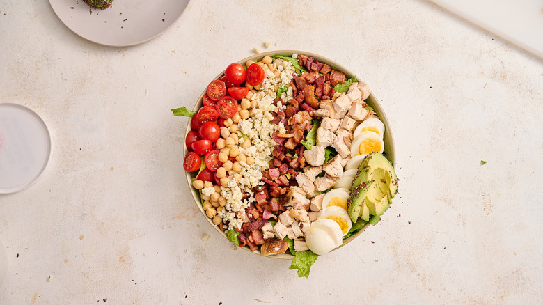 Cobb salad assembled in bowl