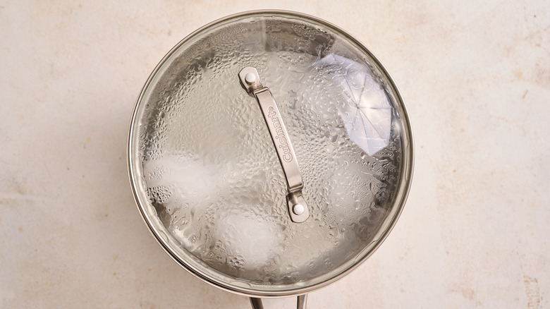 eggs cooking in a covered pot