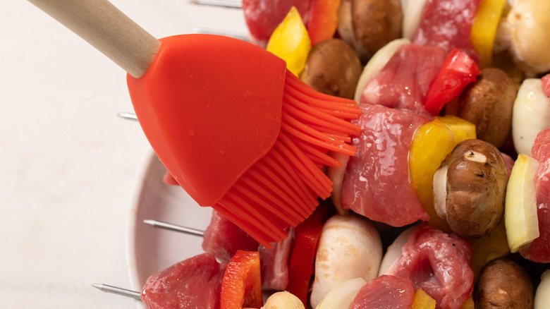 preparing kabobs for cooking