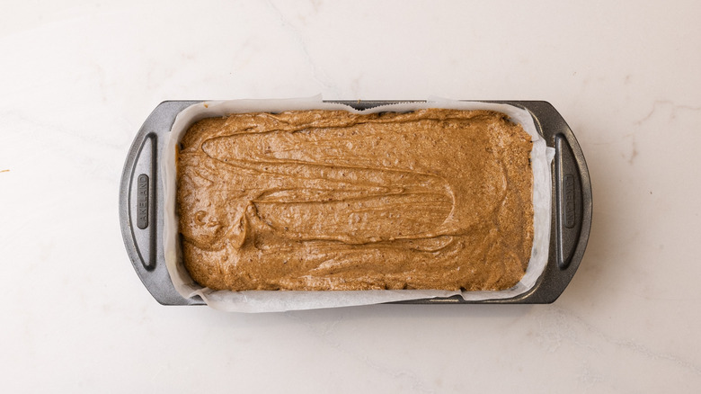 Unbaked cake batter in loaf pan