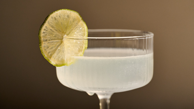 vodka gimlet garnished with lime wheel