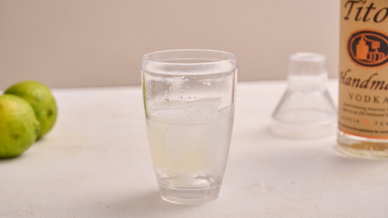 cocktail shaker filled with gimlet ingredients