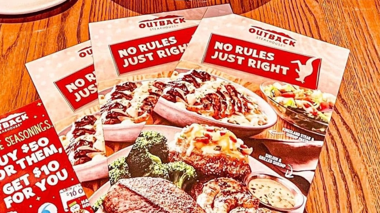 Outback Steakhouse menus on restaurant table