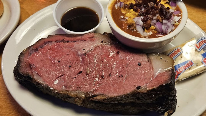 close up of Texas Roadhouse prime rib with a side of chili