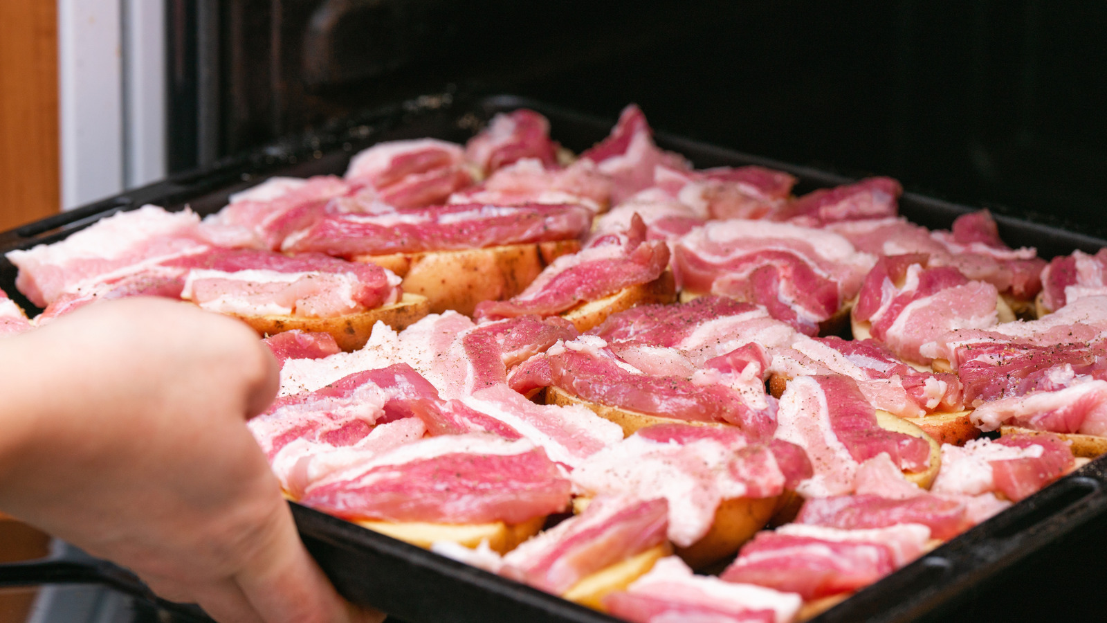 When Oven-Cooking Bacon, Skip This Tip That Just Results In Extra Cleanup - Tasting Table