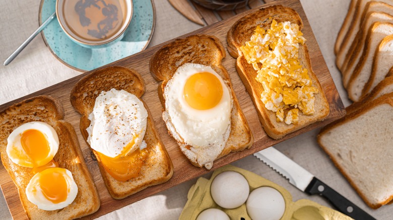 Different types of cooked eggs on toast