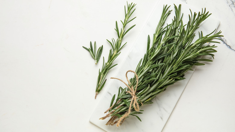 Bunch of rosemary on marble counter