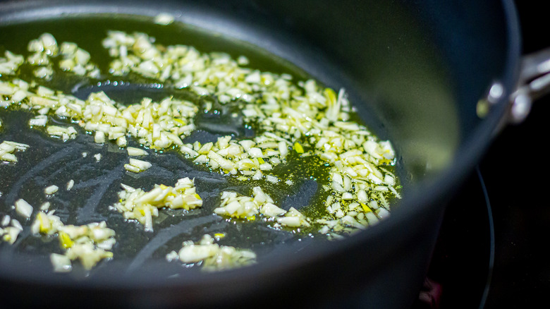minced garlic cooking in olive oil