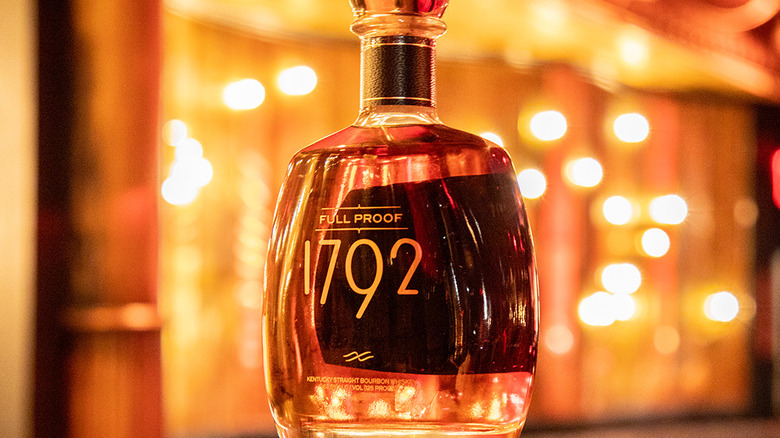 Bottle of 1792 Full Proof in front of a blurred, bright background