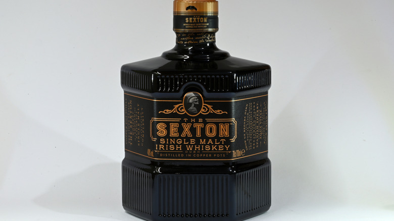 Bottle of The Sexton Single Malt Irish Whiskey on a plain white background