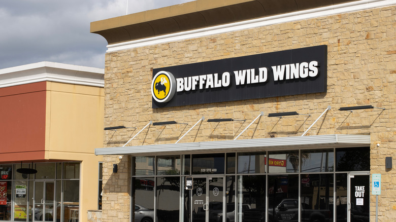 Front view of a Buffalo Wild Wings restaurant on a cloudy day