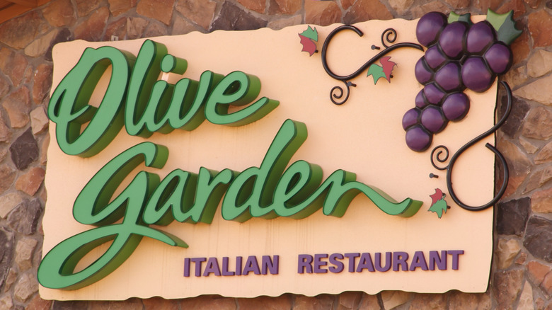 Close-up of the exterior of an Olive Garden restaurant with a large sign
