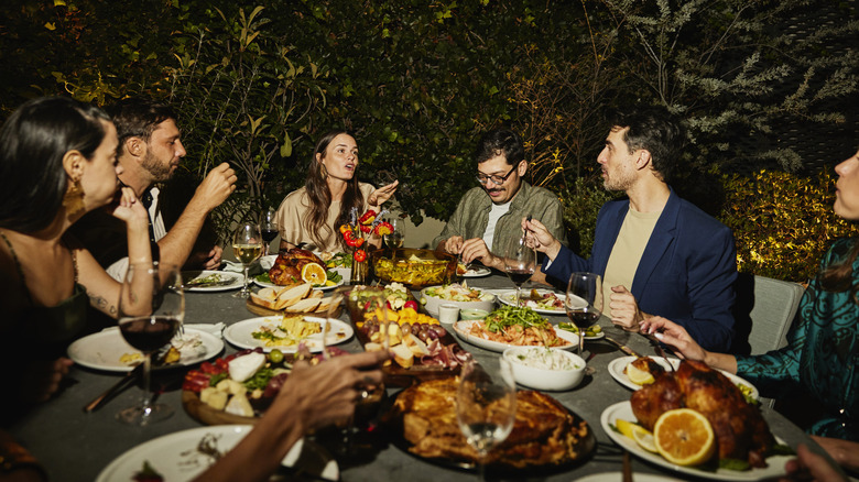 friends talking at dinner party