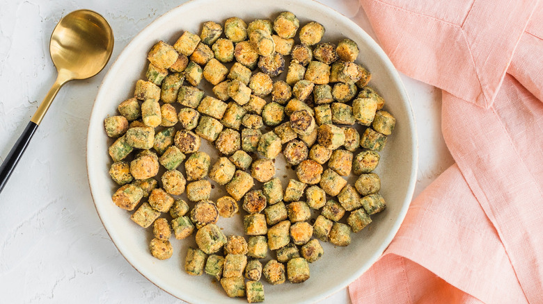 Pan fried okra and gold spoon