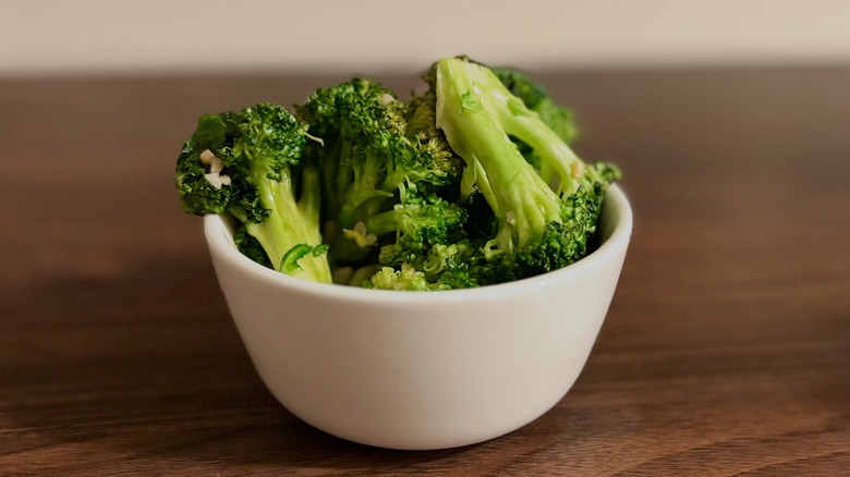 Small white bowl piled with broccoli