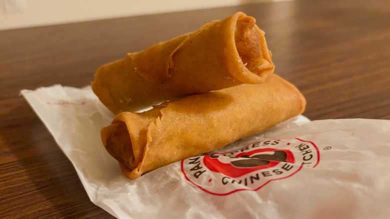 Two veggie egg rolls stacked on top of one another