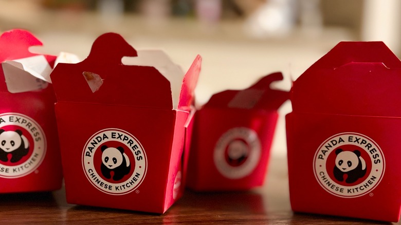 Several small Panda Express red takeout containers