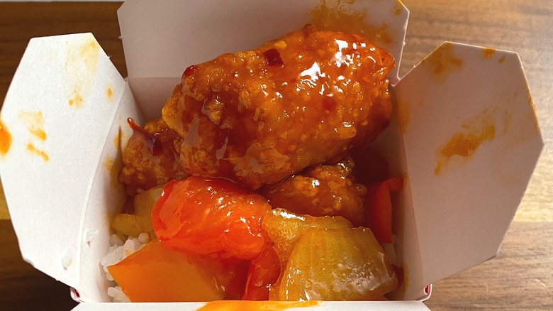 Close-up of Panda Express Dynamite Sweet & Sour Chicken in takeout container