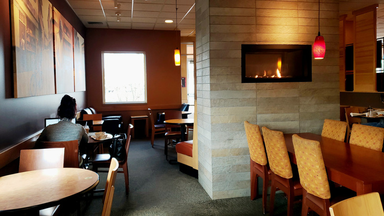 Person at Panera Bread location with laptop
