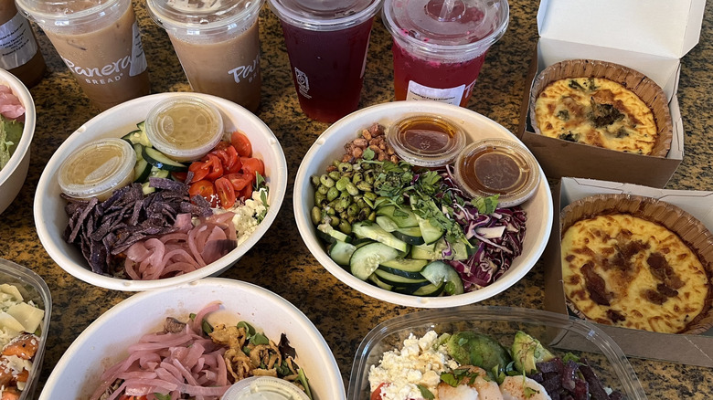 Side view of drinks and salads from Panera on the countertop