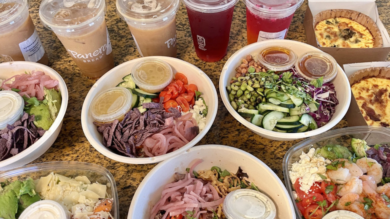 Close up view of bowls and salads on a counter