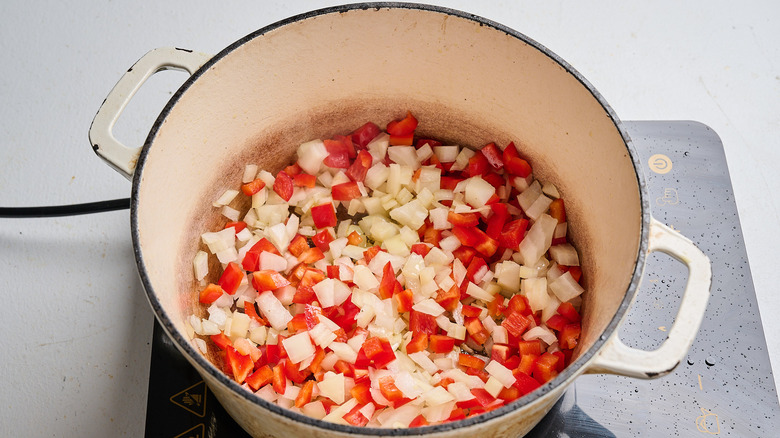 softening onion and pepper in a pot