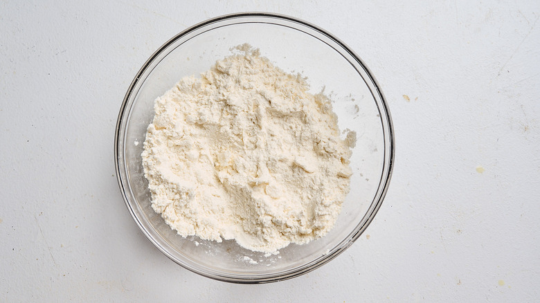 combining dumpling ingredients in a bowl