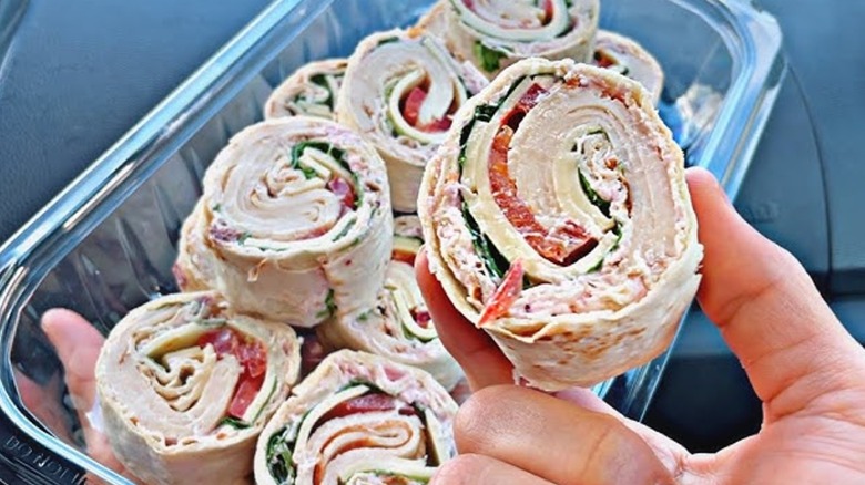 Roasted chicken and Swiss rollers with lettuce, tomato, and cream cheese