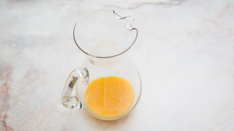 Passion fruit juice in large pitcher