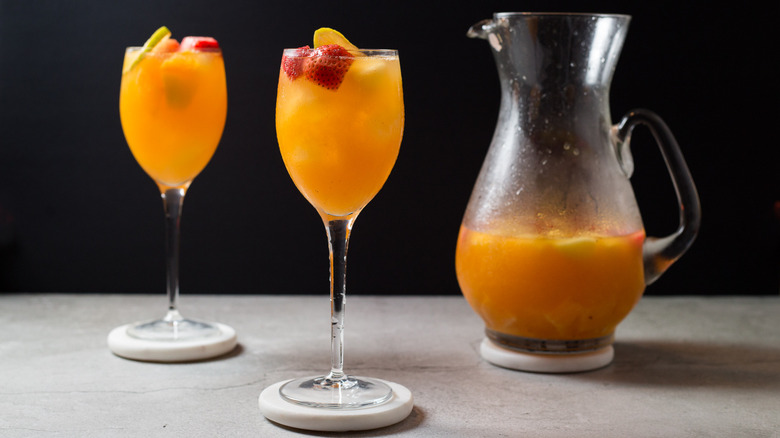 Passion fruit sangria glasses served on gray table