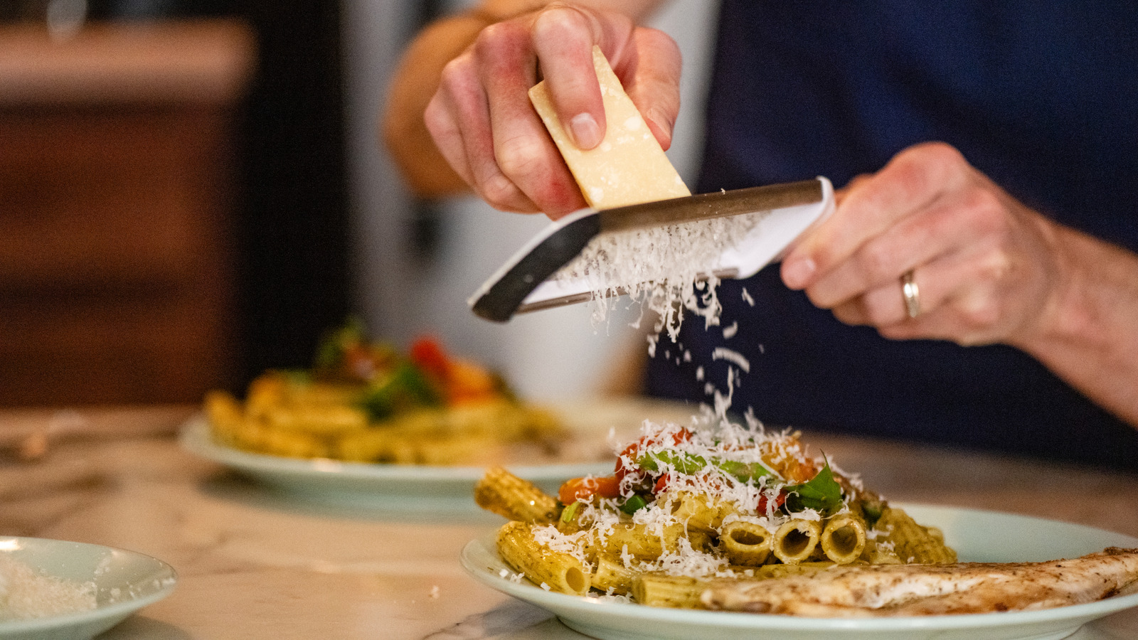 The Major Mistake Almost Everyone Makes When Adding Cheese To Pasta (It's So Simple)