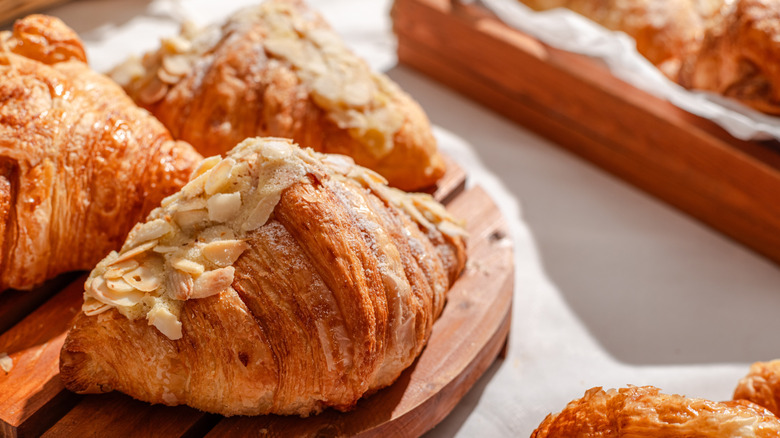 Almond croissants on a wooden board
