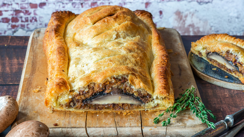 Vegan wellington on a wooden board on a wooden table
