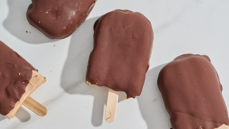 peanut butter yogurt popsicles on a table