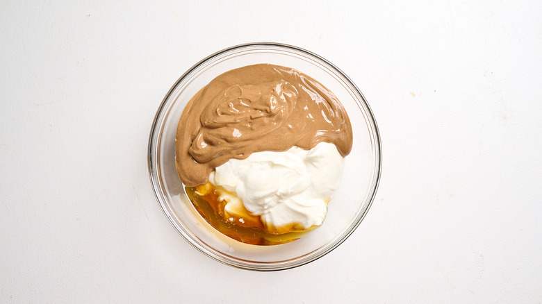 yogurt, peanut butter, and maple syrup in a bowl